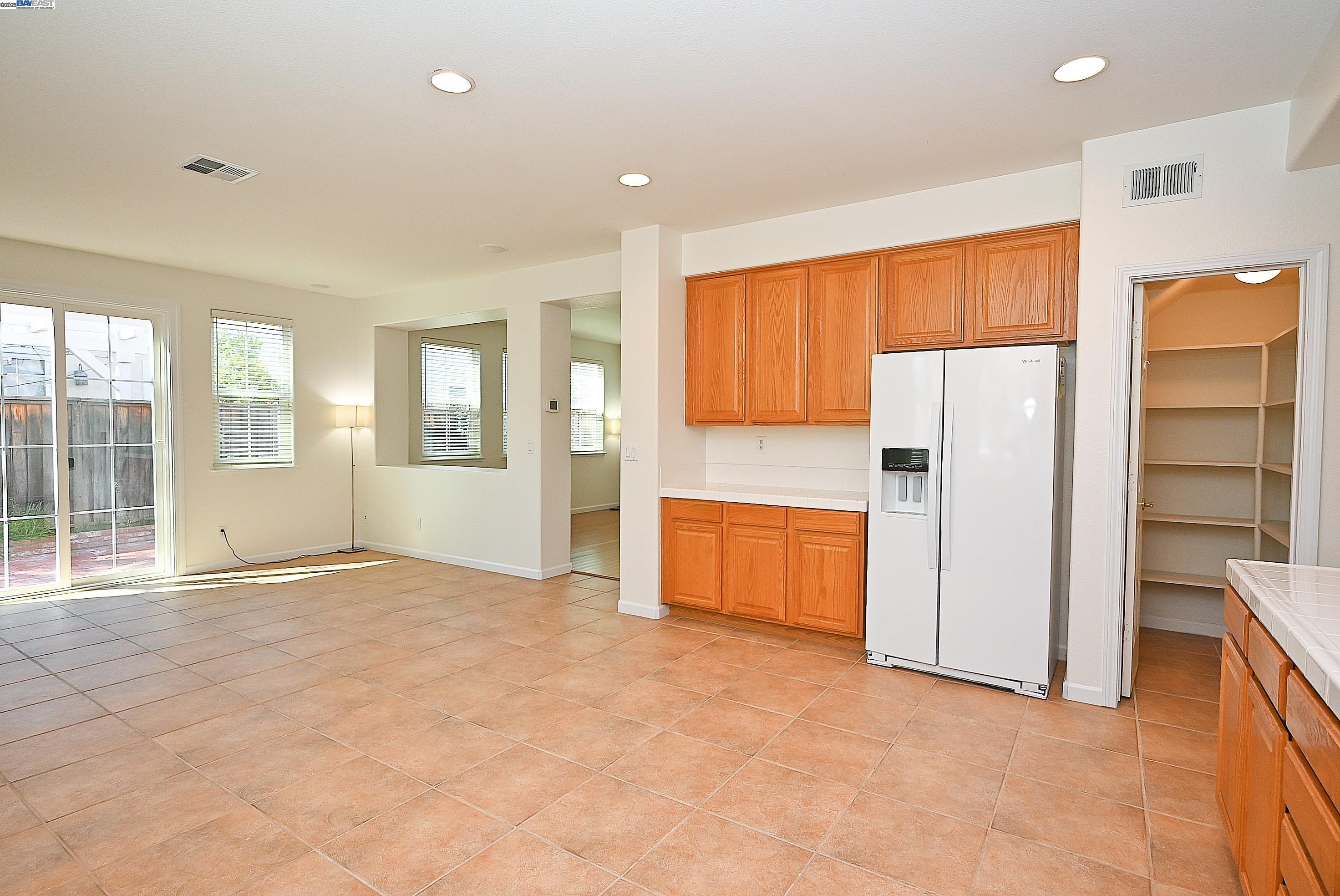 4189 Tessa Place Pleasanton, CA 94566 - Photo 12 of 41 a view of an empty room with a kitchen