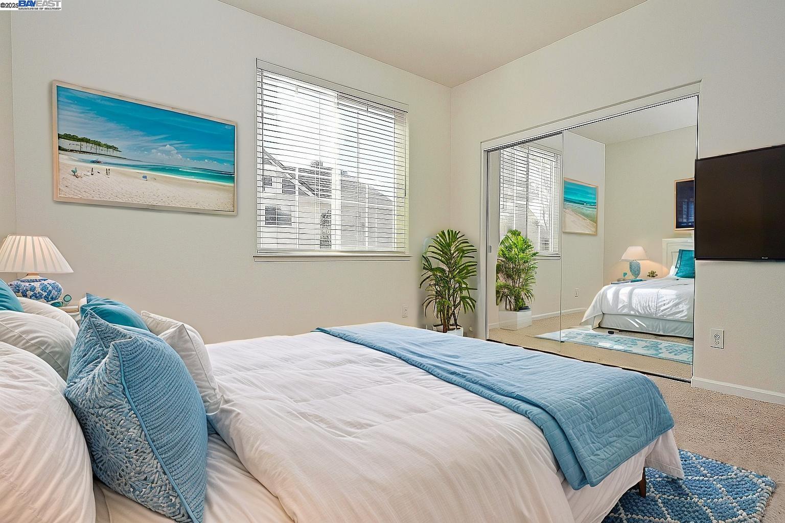 4189 Tessa Place Pleasanton, CA 94566 - Photo 29 of 41 a bedroom with a bed and flat screen tv