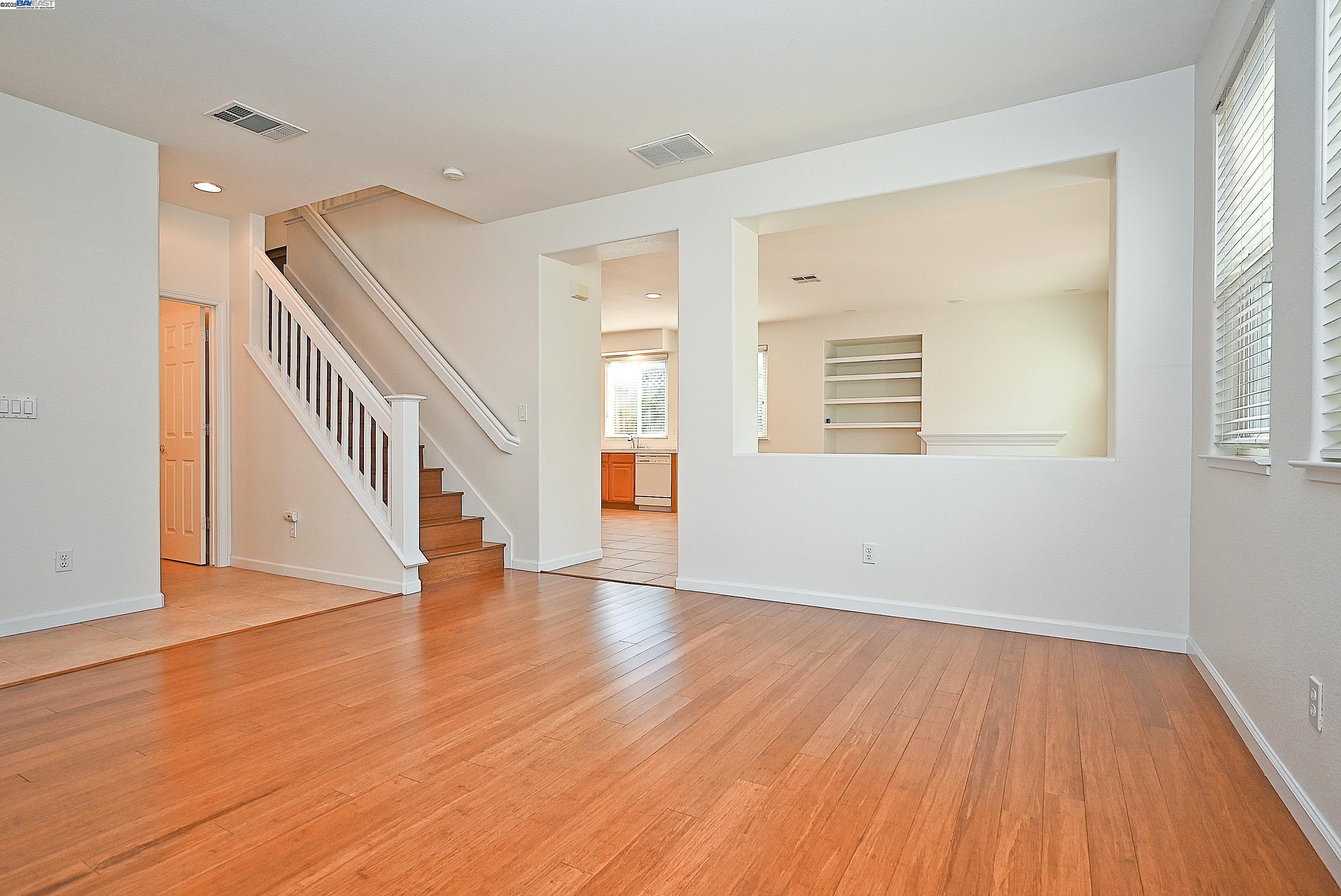 4189 Tessa Place Pleasanton, CA 94566 - Photo 5 of 41 a view of an empty room with wooden floor and a window