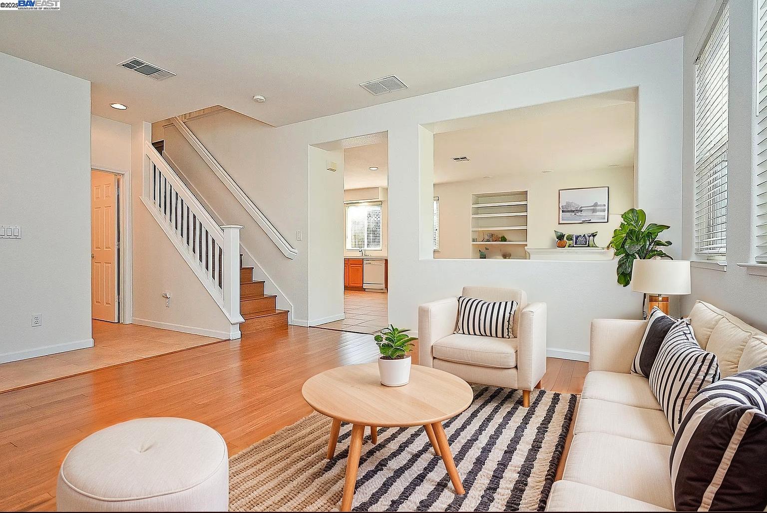 4189 Tessa Place Pleasanton, CA 94566 - Photo 6 of 41 a living room with furniture and a wooden floor