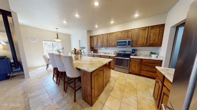 a kitchen with sink and refrigerator