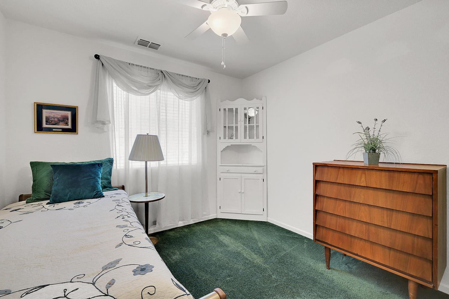 9840 Ellis Way Live Oak, CA 95953 - Photo 32 of 44 a bed room with a bed and a lamp