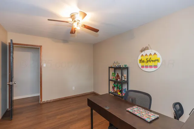 a workspace with furniture and window