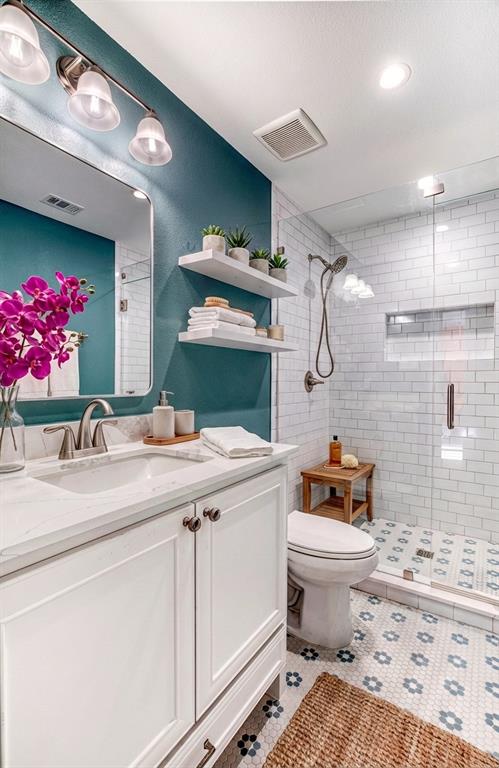 5123 Milam Street Dallas, TX 75206 - Photo 12 of 40 The cutest new addition bathroom with shared access for the coral and green rooms - the daisy tile is too fun!