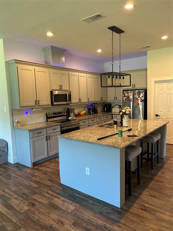 2631 Fish Tank Road Corsicana, TX 75110 - Photo 12 of 31 a kitchen with kitchen island granite countertop a sink appliances and cabinets