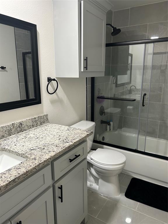 2631 Fish Tank Road Corsicana, TX 75110 - Photo 30 of 31 a bathroom with a granite countertop sink toilet and shower
