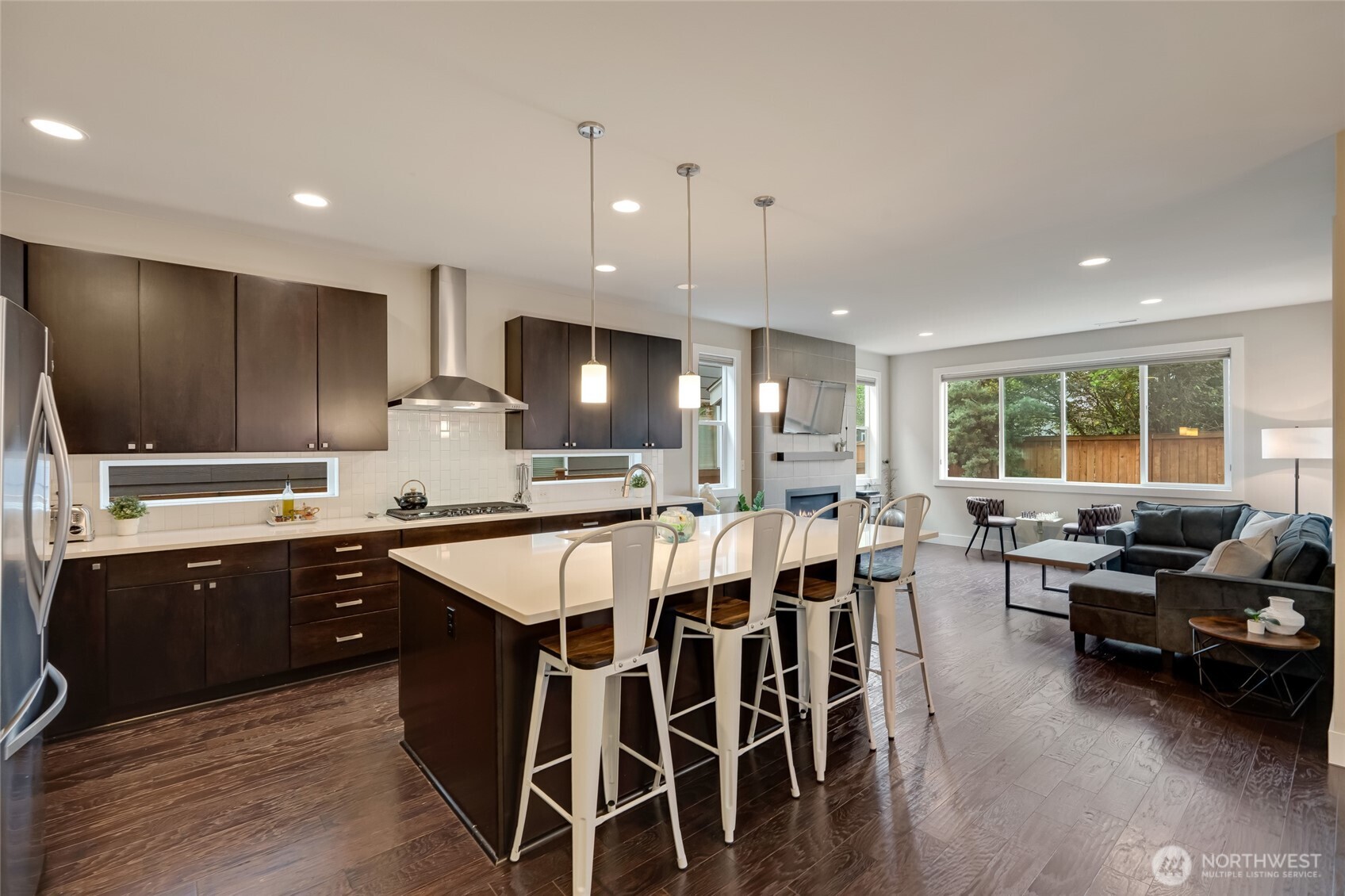 20025 6th Drive Southeast Bothell, WA 98012 - Photo 11 of 40 a kitchen with stainless steel appliances granite countertop sink stove and wooden floor