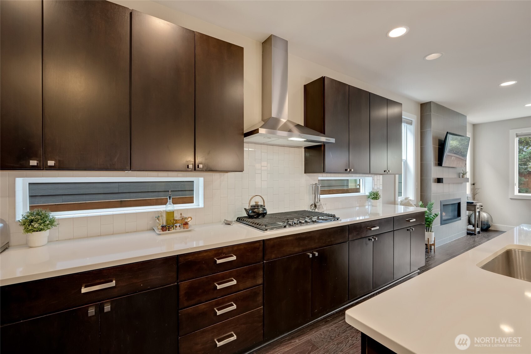20025 6th Drive Southeast Bothell, WA 98012 - Photo 16 of 40 a kitchen with stainless steel appliances a sink stove and refrigerator