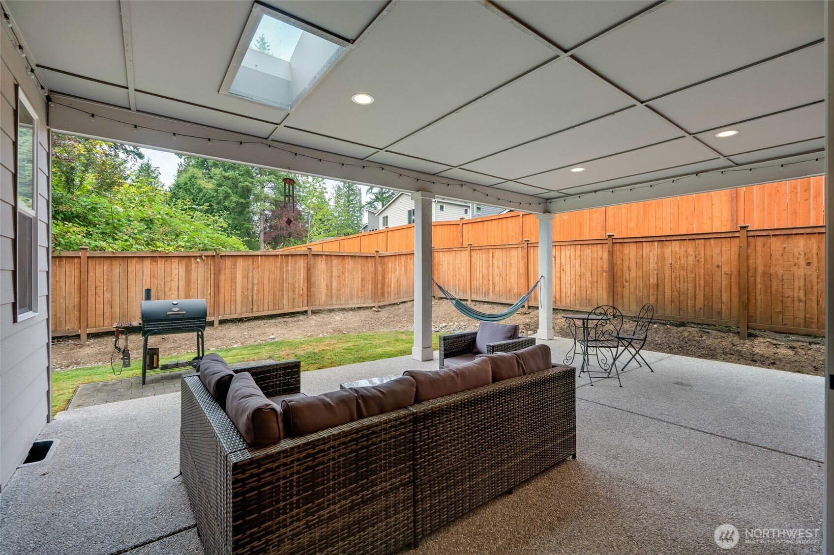 20025 6th Drive Southeast Bothell, WA 98012 - Photo 18 of 40 a outdoor living space with patio furniture and a garden