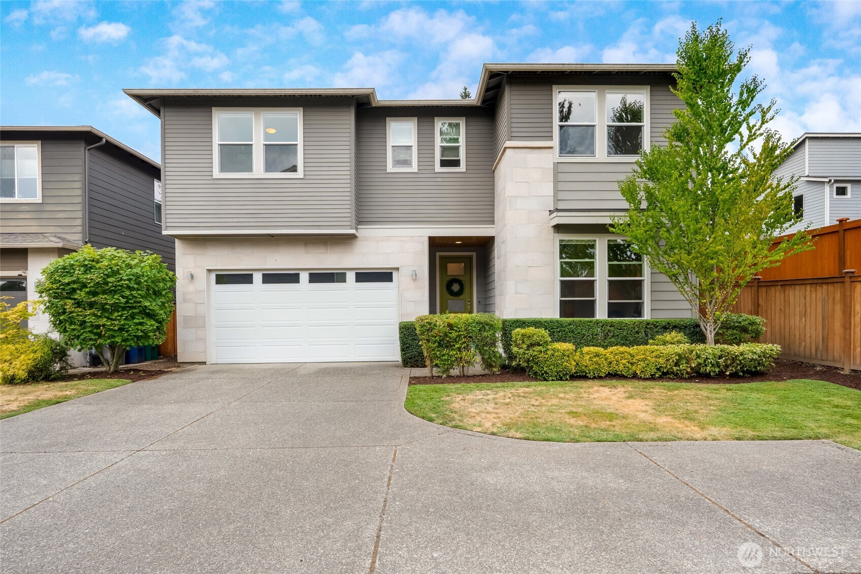 20025 6th Drive Southeast Bothell, WA 98012 - Photo 2 of 40 a front view of a house with a yard and garage