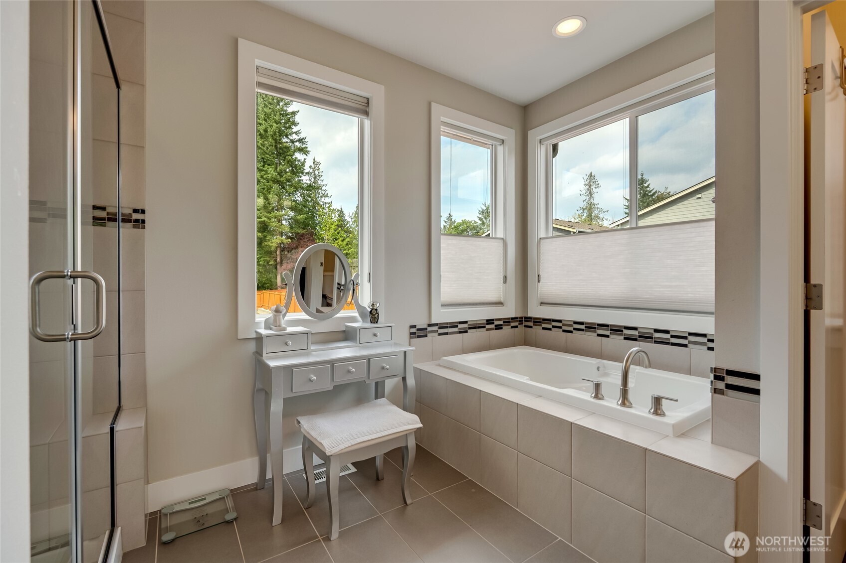 20025 6th Drive Southeast Bothell, WA 98012 - Photo 27 of 40 a bathroom with a tub sink and mirror