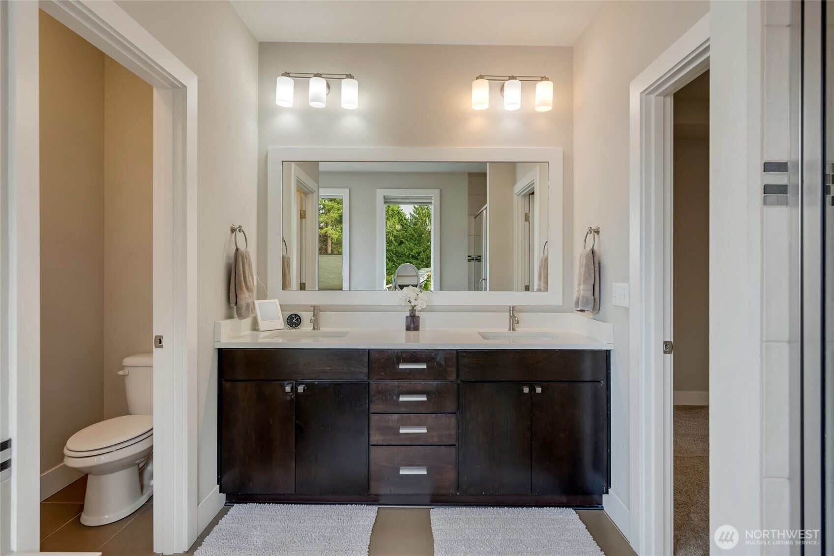20025 6th Drive Southeast Bothell, WA 98012 - Photo 28 of 40 a bathroom with a granite countertop sink a toilet and a mirror
