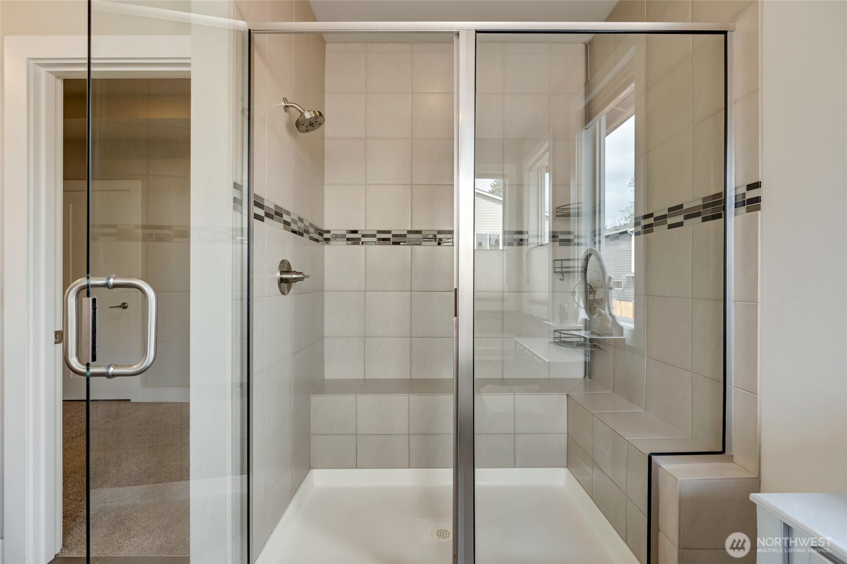 20025 6th Drive Southeast Bothell, WA 98012 - Photo 29 of 40 a bathroom with a glass shower door