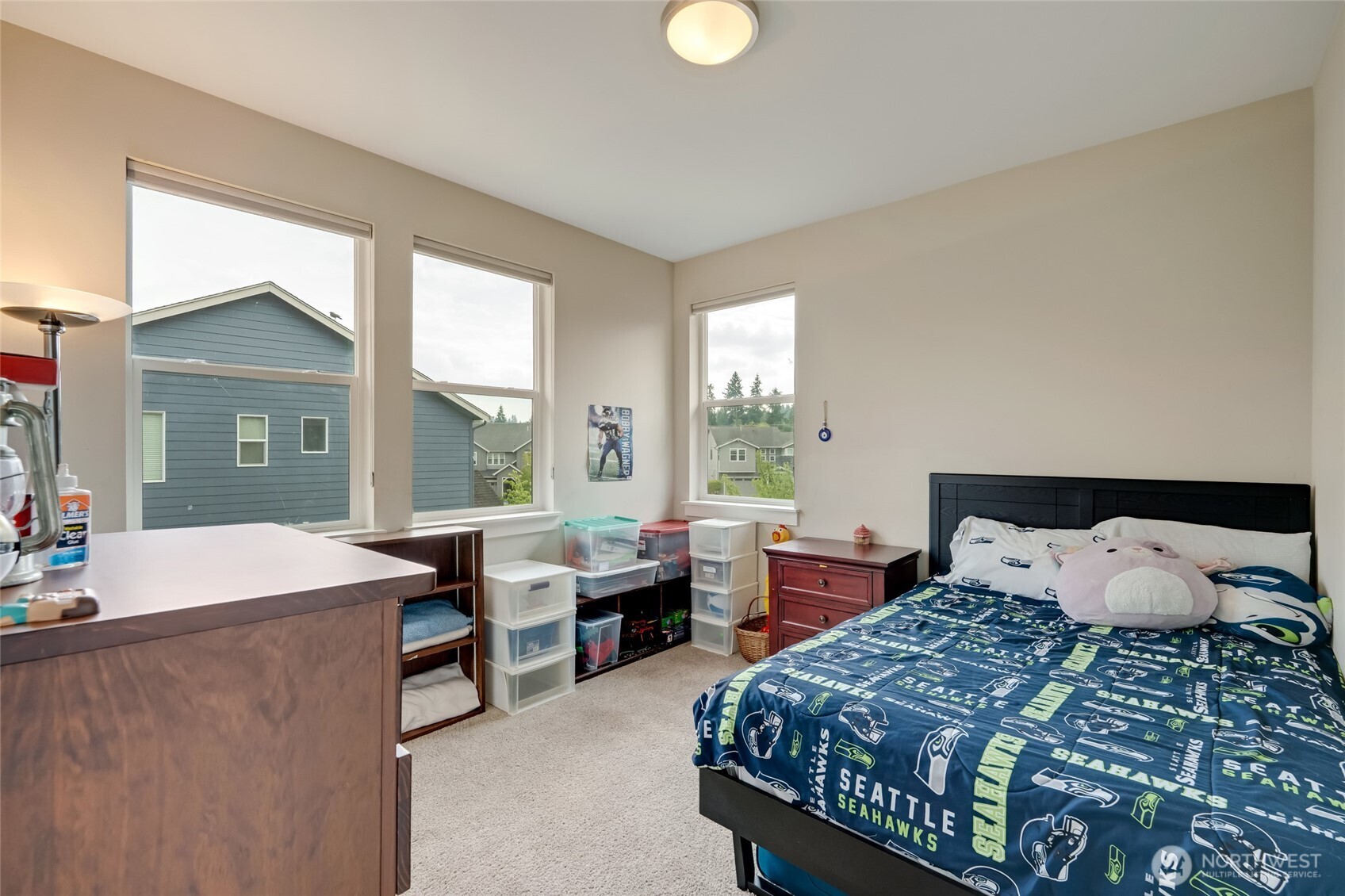 20025 6th Drive Southeast Bothell, WA 98012 - Photo 32 of 40 a bedroom with a bed and a large window