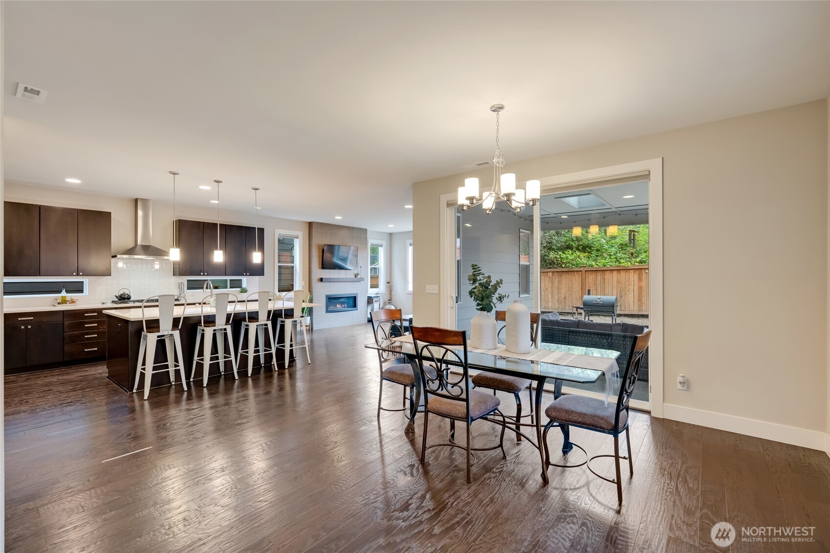 20025 6th Drive Southeast Bothell, WA 98012 - Photo 8 of 40 a dining room with furniture a chandelier and wooden floor