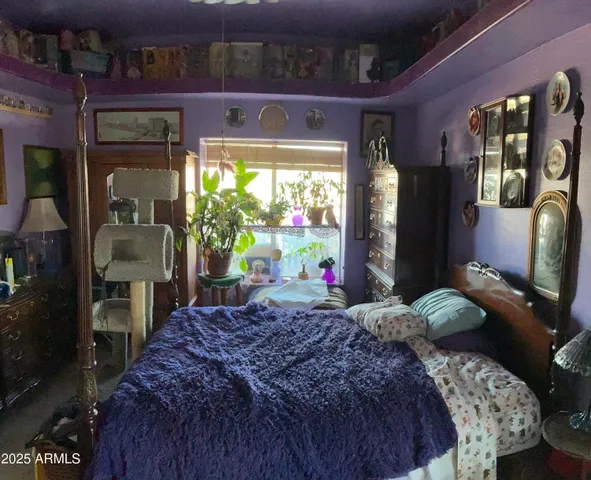 a living room with furniture and a mirror