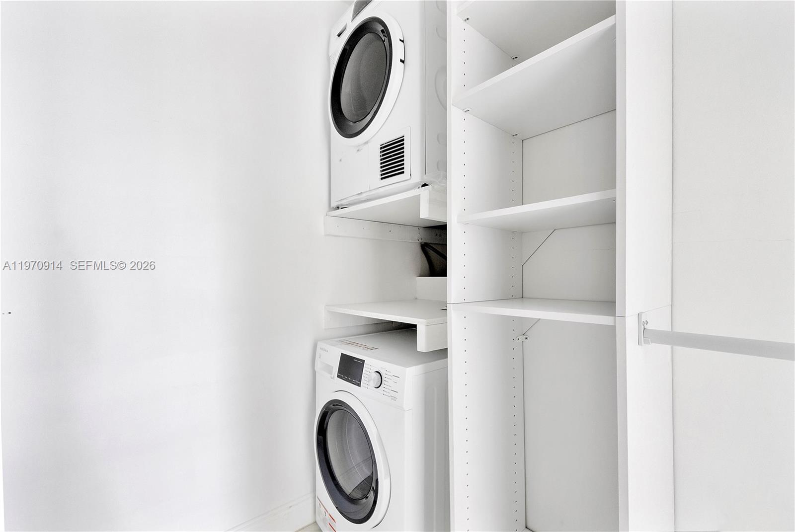 336 North Birch Road, Unit PH Fort Lauderdale, FL 33304 - Photo 28 of 68 a view of entryway with washer and dryer