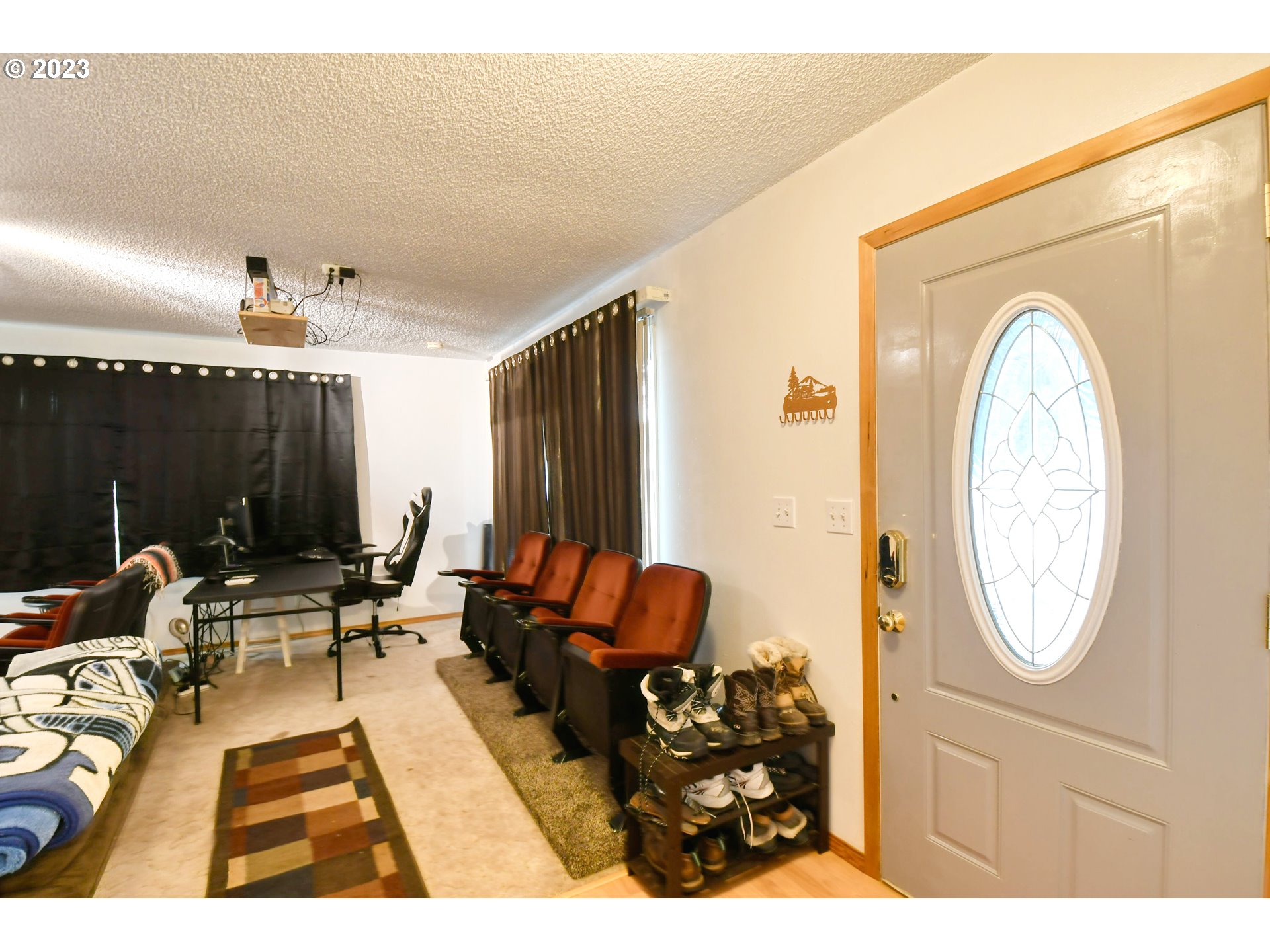 1382 Southwest 39th Street Pendleton, OR 97801 - Photo 13 of 40 a living room with furniture a chandelier and a large mirror