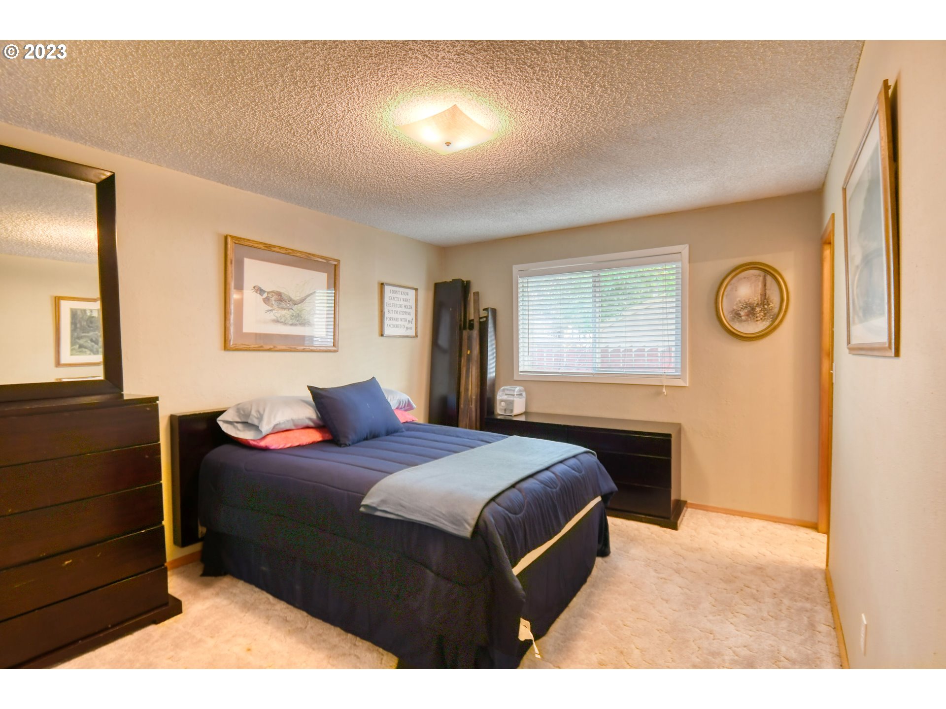 1382 Southwest 39th Street Pendleton, OR 97801 - Photo 20 of 40 a bedroom with a bed and a dresser