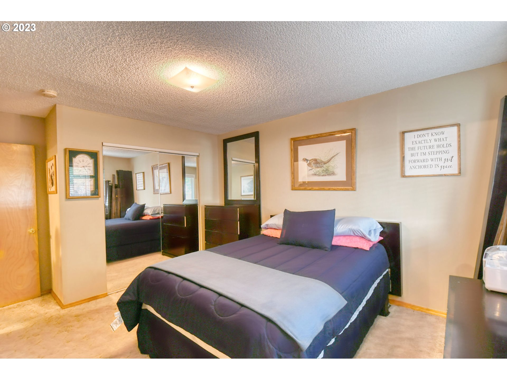 1382 Southwest 39th Street Pendleton, OR 97801 - Photo 21 of 40 a bedroom with a large bed and a couch