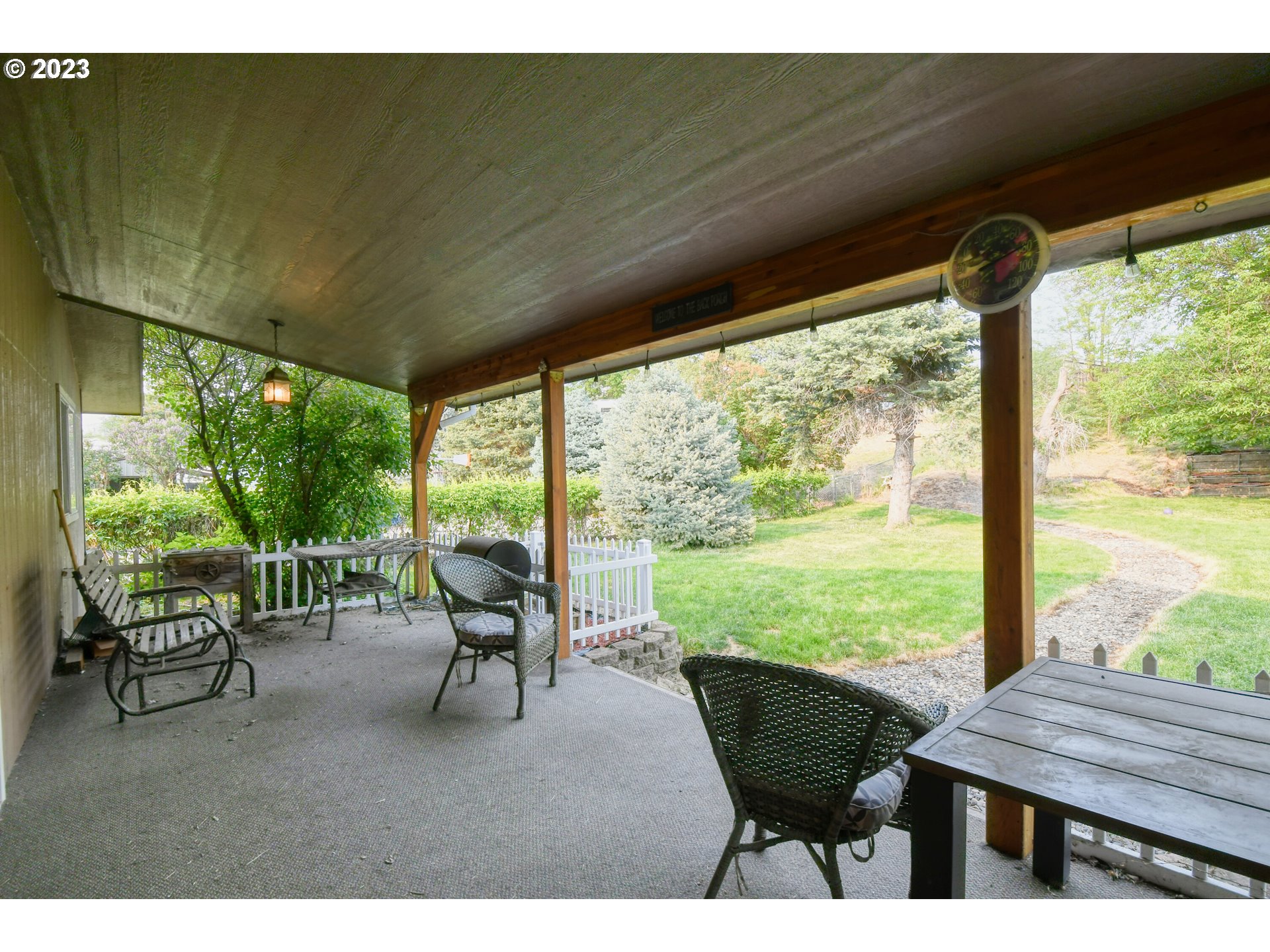 1382 Southwest 39th Street Pendleton, OR 97801 - Photo 31 of 40 a view of a patio with chairs and floor to ceiling window