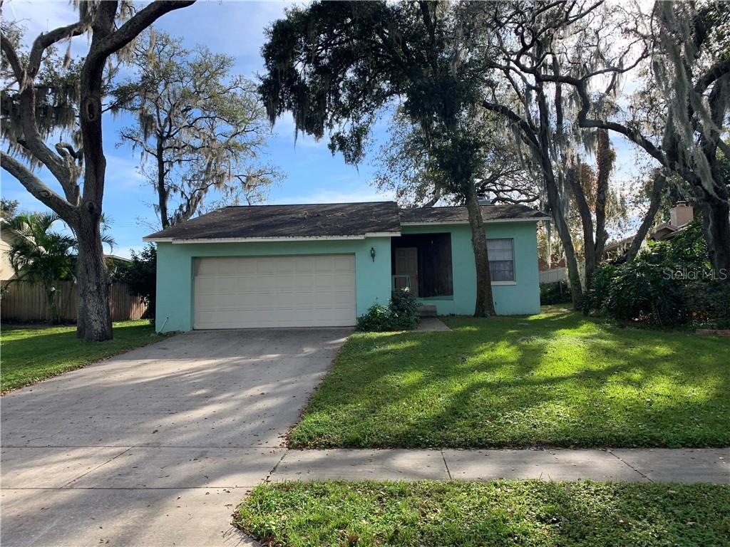 107 Quail Ridge Court Sanford, FL 32771 - Photo 1 of 1 a front view of a house with a yard and garage