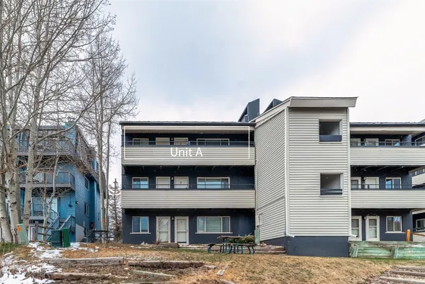 a view of balcony with a table and chairs