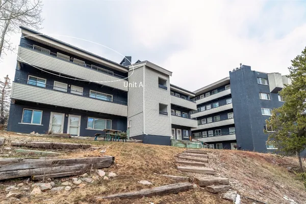 a front view of a house with a garage