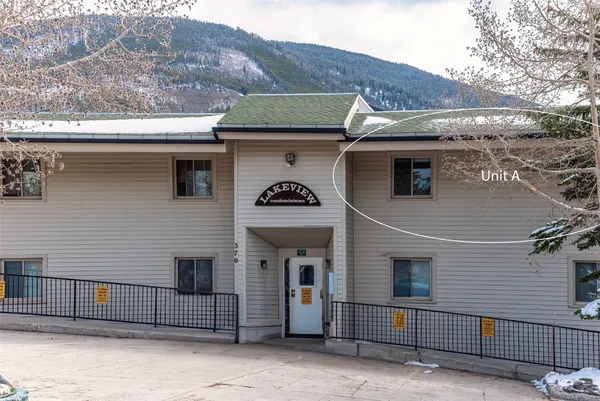 a side view of a house with a yard