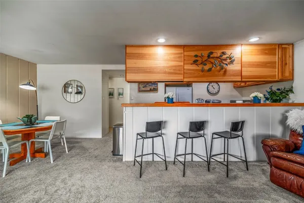 a room with furniture a chandelier and a large window