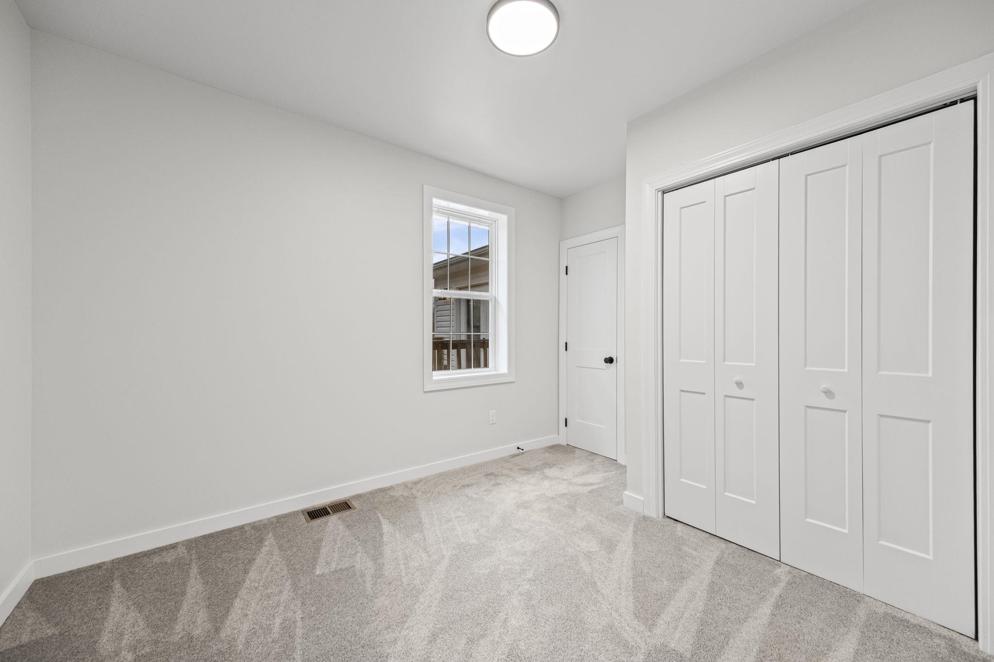 835 Curve Woodville Road Gates, TN 38037 - Photo 18 of 30 Unfurnished bedroom with a closet and carpet