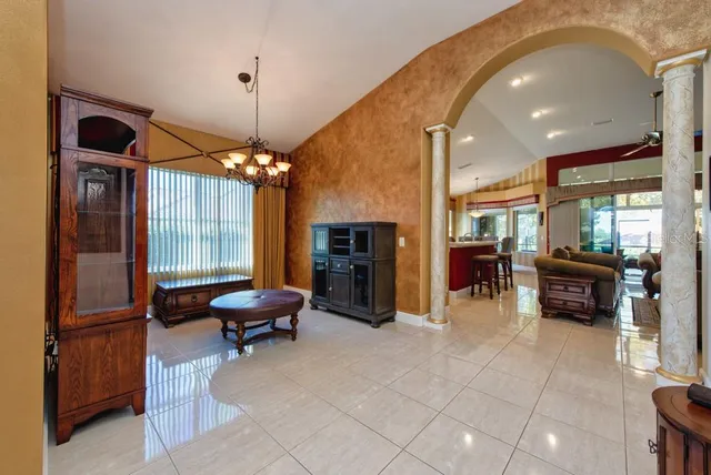 a lobby with furniture and floor to ceiling window