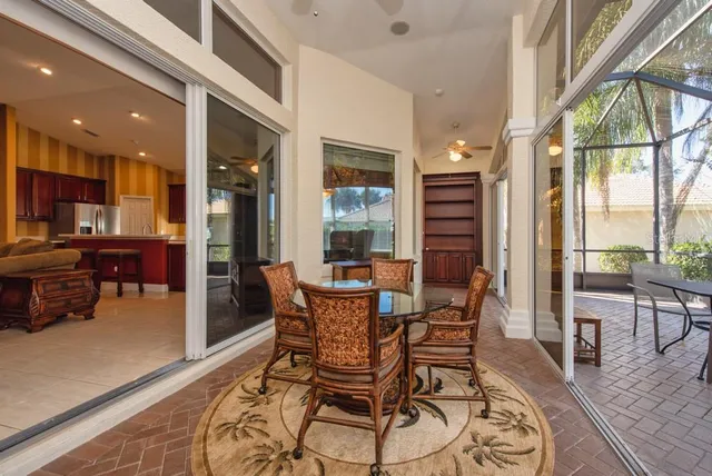 a view of a dining room with furniture window and outside view
