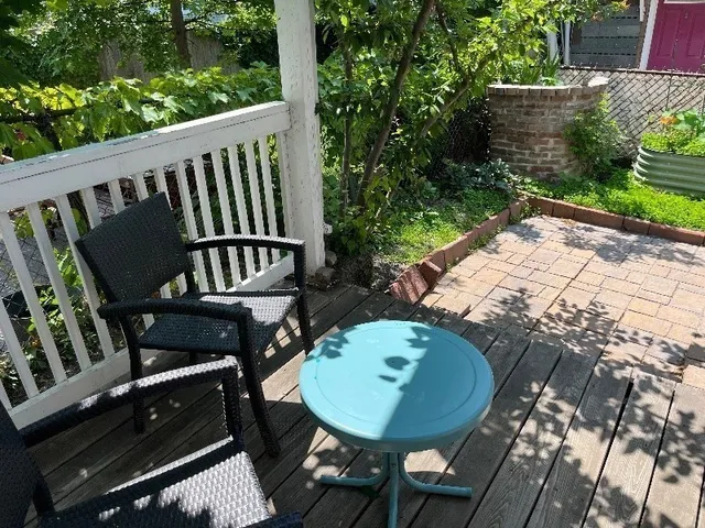 a view of a balcony with chairs