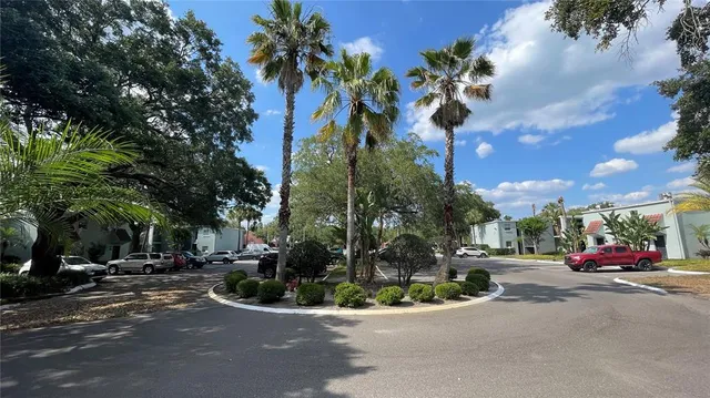 a view of a house with swimming pool and porch with furniture