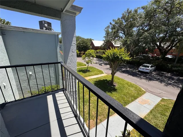 a view of swimming pool from a balcony