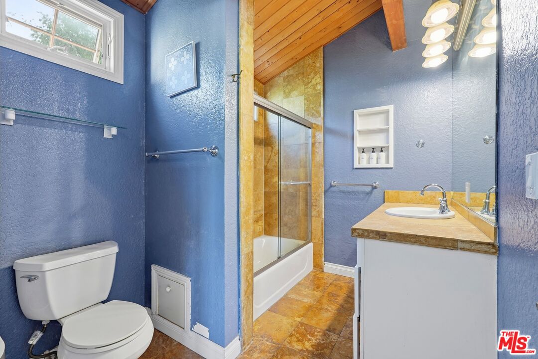 2955 Corral Canyon Road Malibu, CA 90265 - Photo 18 of 21 a bathroom with a granite countertop sink toilet and shower