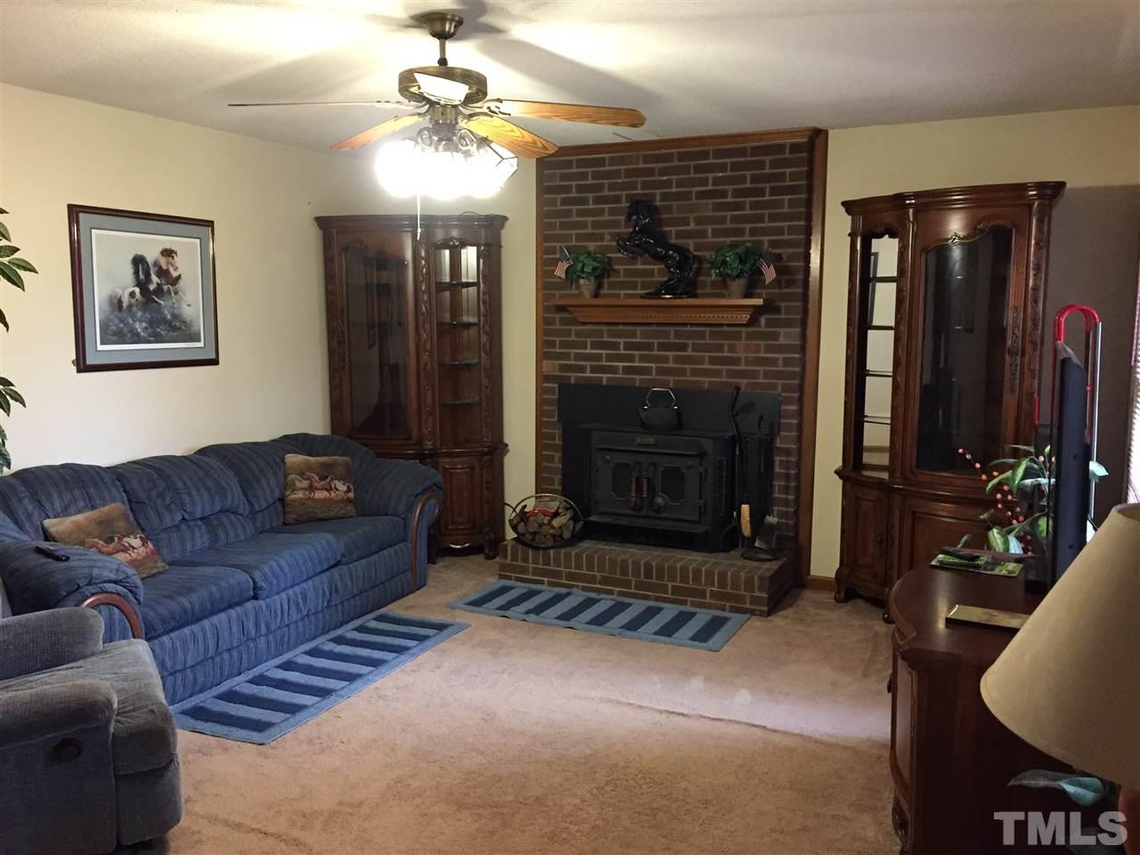 3213 Banks Road Raleigh, NC 27603 - Photo 5 of 16 Large Living Room with wood stove fire place.