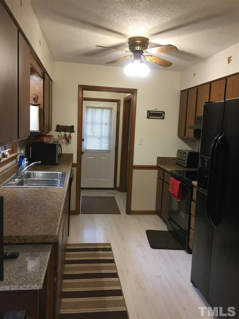 3213 Banks Road Raleigh, NC 27603 - Photo 7 of 16 Has flat top stove and refrigerator.
