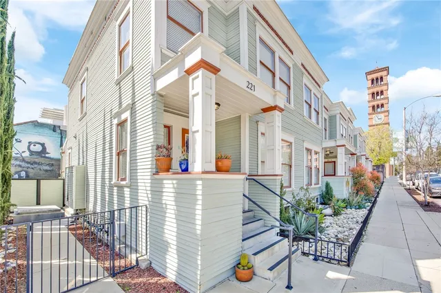 a view of an buildings with backyard and sitting area