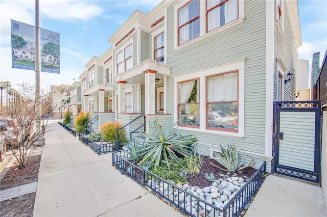 a view of a brick building with large windows