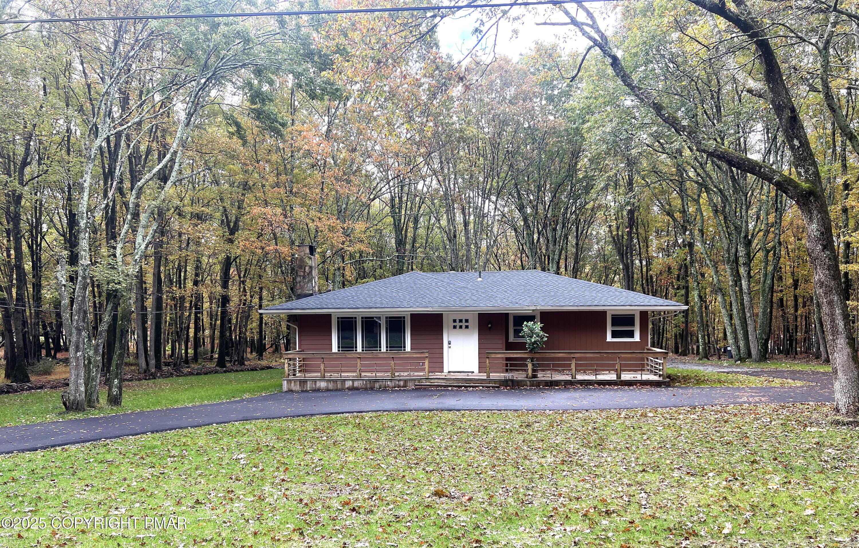 a view of a table and chairs under an umbrella