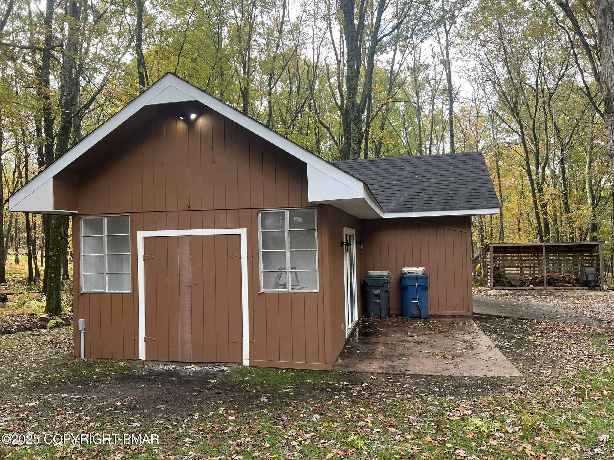 140 Davis Circle Bushkill, PA 18324 - Photo 22 of 31 a front view of a house with a yard and garage