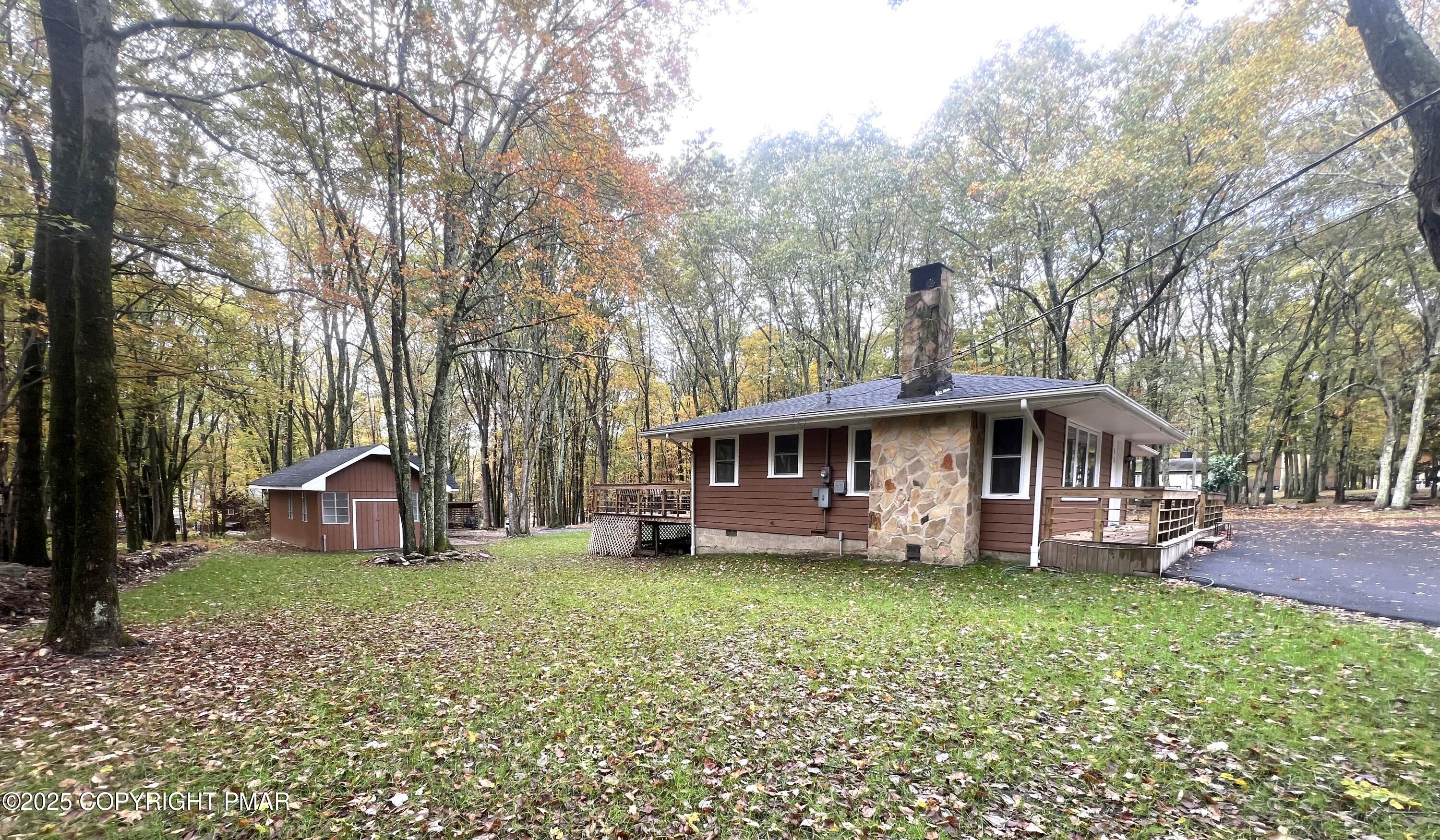 140 Davis Circle Bushkill, PA 18324 - Photo 30 of 31 a view of a house with a yard and large trees