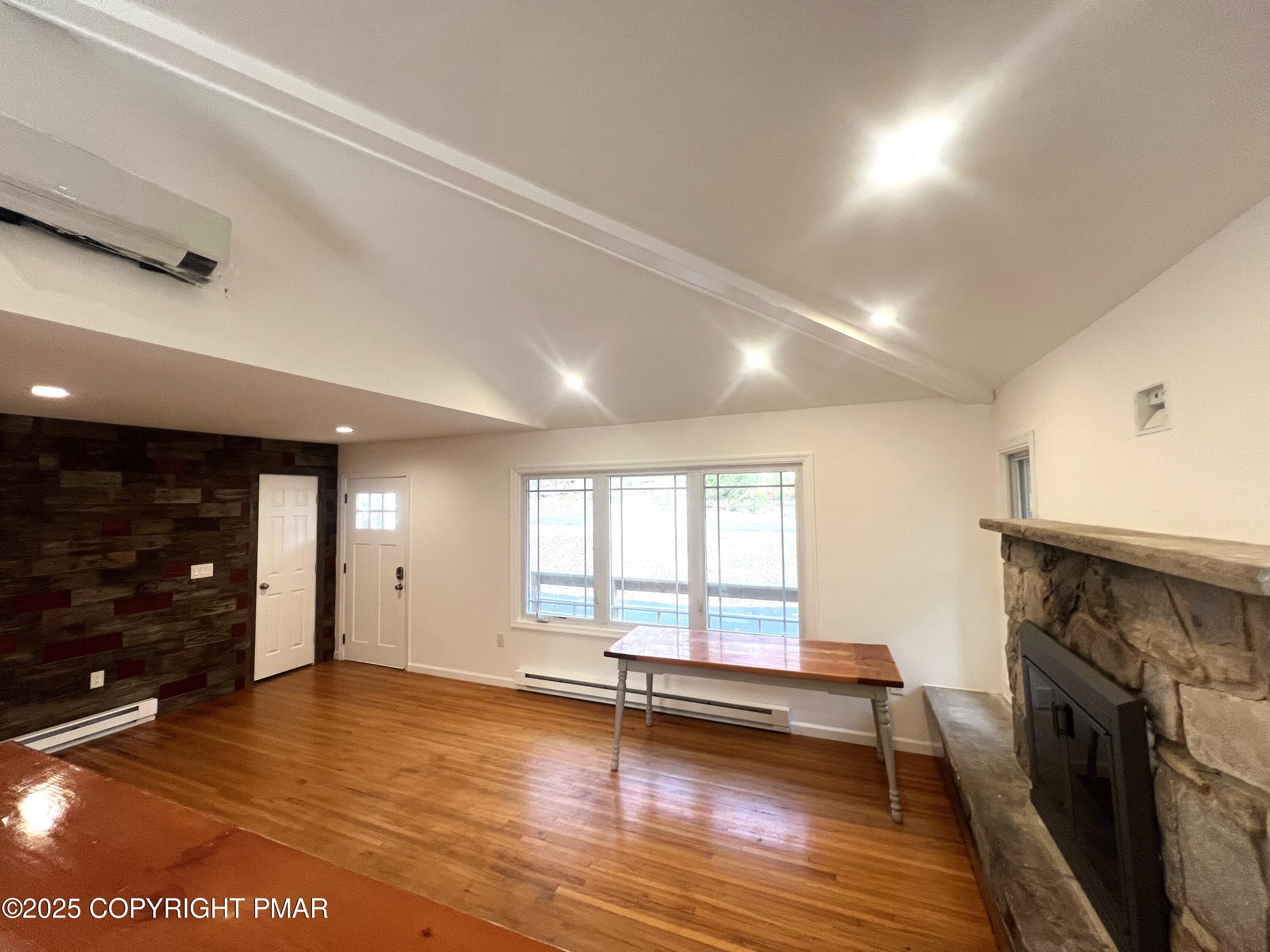 140 Davis Circle Bushkill, PA 18324 - Photo 5 of 31 a view of empty room with wooden floor and fan