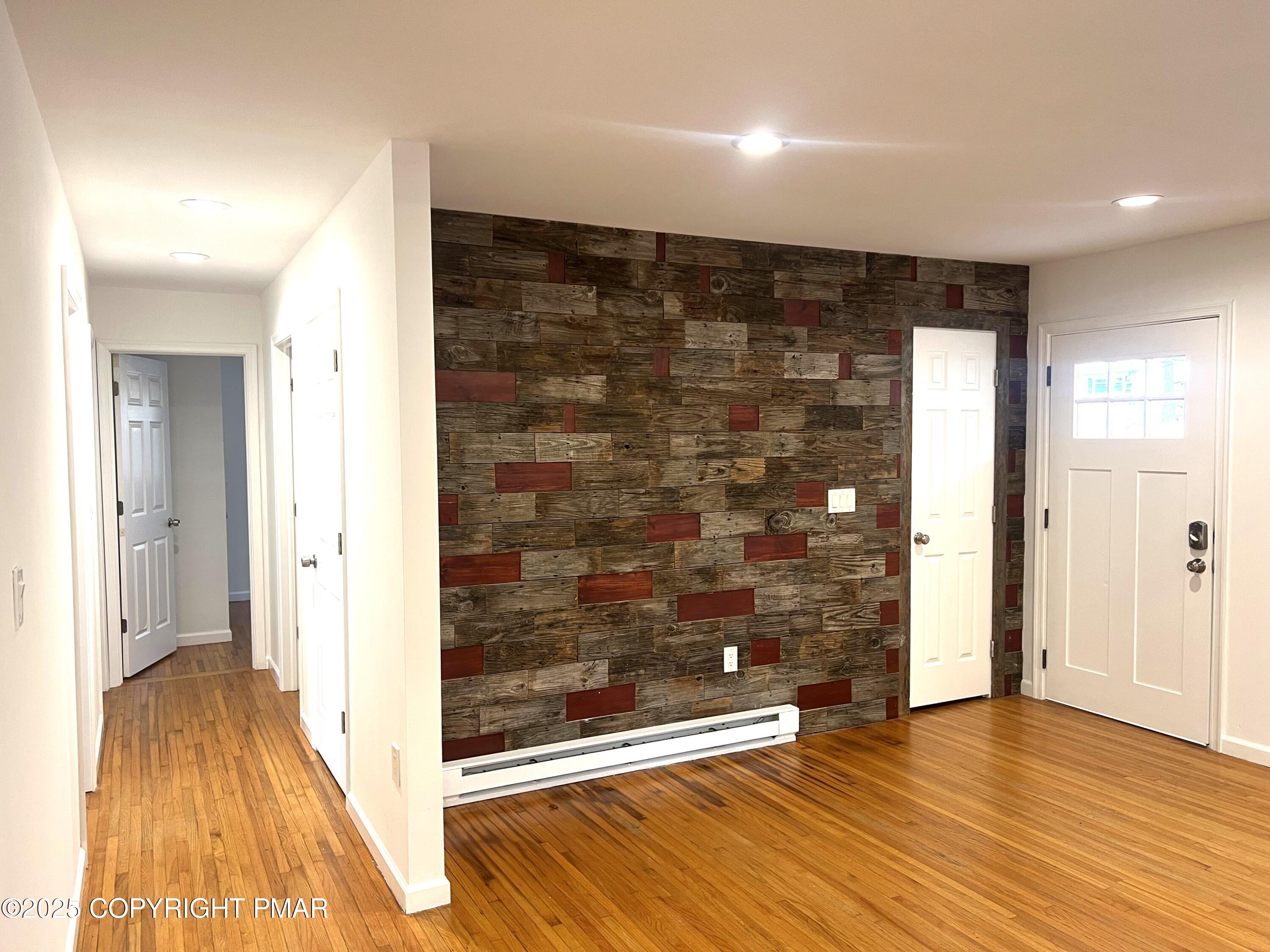 140 Davis Circle Bushkill, PA 18324 - Photo 10 of 31 wooden floor in an empty room with a gallery