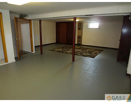 318 New Market Road Dunellen, NJ 08812 - Photo 21 of 23 a view of livingroom with hardwood floor and hallway
