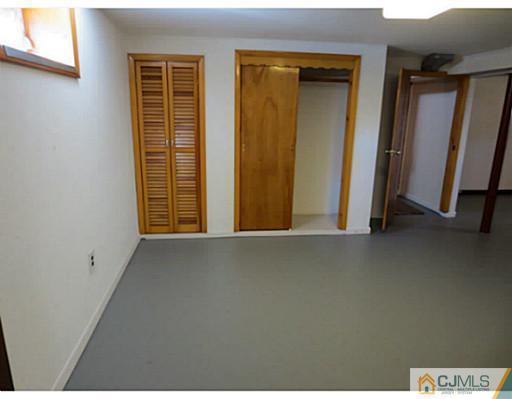 318 New Market Road Dunellen, NJ 08812 - Photo 22 of 23 a view of a closet area with front door