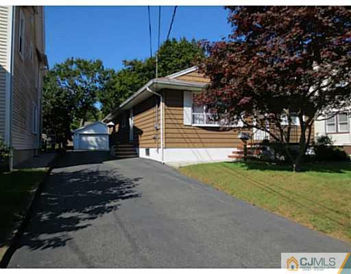 318 New Market Road Dunellen, NJ 08812 - Photo 8 of 23 a view of a house with backyard and garden