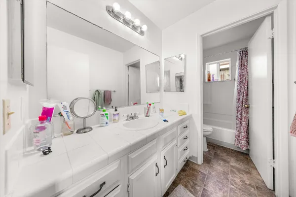 a bathroom with a double vanity sink mirror and double
